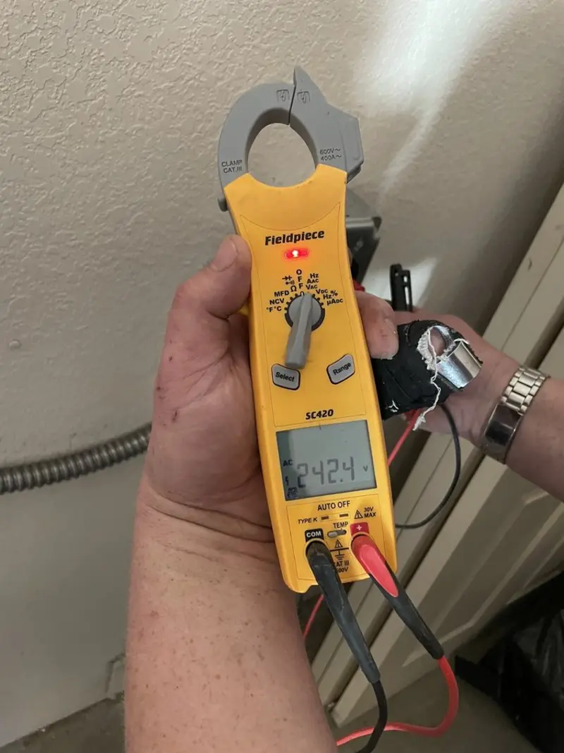 Voltage testing with clamp meter during Electrical Installation Services in Harrington